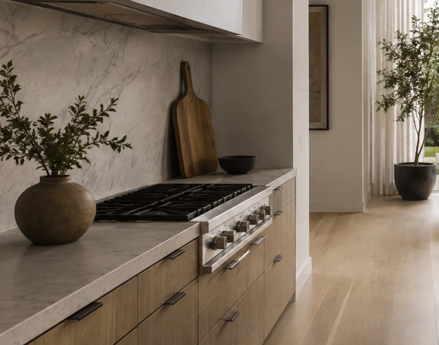 Illustrative stone, cabinetry, appliance, and finish detail in a residential kitchen.
